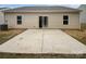 Simple backyard area featuring a concrete patio and grass at 1235 Culver Spring Way, Charlotte, NC 28215