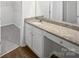 Bathroom with a vanity area featuring granite counters, lots of storage, and neutral finishes at 1235 Culver Spring Way, Charlotte, NC 28215