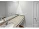 Bright bathroom featuring granite countertop, vanity sink and large mirror, and ample lighting at 1235 Culver Spring Way, Charlotte, NC 28215