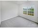 Bright and airy bedroom with plush carpeting and large window providing natural light at 1235 Culver Spring Way, Charlotte, NC 28215