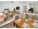 Open-concept living area with modern furnishings, recessed lighting, and seamless flow to the dining and kitchen spaces at 1235 Culver Spring Way, Charlotte, NC 28215