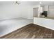 Bright living room showcasing a smooth transition from the hardwood style flooring to new neutral carpeting at 1235 Culver Spring Way, Charlotte, NC 28215