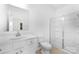 Bathroom with a single sink, vanity, and modern shower with sliding glass doors at 12437 Walker Dr # 89, Stanfield, NC 28163