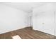 Bedroom with hardwood floors, a closet, and white walls at 12437 Walker Dr # 89, Stanfield, NC 28163