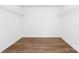 Walk-in closet with wood-look flooring and white shelving at 12437 Walker Dr # 89, Stanfield, NC 28163