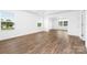 Spacious living room with many windows and wood-look flooring at 12437 Walker Dr # 89, Stanfield, NC 28163