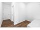 Open room with wood-look flooring and white walls at 12437 Walker Dr # 89, Stanfield, NC 28163