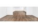 A bright open room, featuring wood-look flooring and neutral walls at 12437 Walker Dr # 89, Stanfield, NC 28163