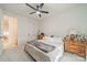 Bedroom featuring soft lighting, ceiling fan, and a plush bed with elegant decor at 1402 Encore Ln, Waxhaw, NC 28173