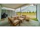 Inviting covered patio with stylish outdoor furniture, grill and green grass at 1402 Encore Ln, Waxhaw, NC 28173
