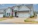 Charming two-story home with a well-manicured lawn and a two-car garage at 1402 Encore Ln, Waxhaw, NC 28173