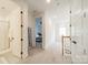 Hallway featuring clean lines, bright lighting, and doorways to various rooms at 1402 Encore Ln, Waxhaw, NC 28173