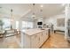 Spacious kitchen includes a large island with bar seating, stainless appliances, and an open floor concept at 1402 Encore Ln, Waxhaw, NC 28173