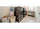 Modern laundry room with sleek washer and dryer units and ample storage space at 1402 Encore Ln, Waxhaw, NC 28173