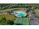 Aerial view of the resident's clubhouse, pool, tennis courts, and parking at 14103 Grand Traverse Dr, Charlotte, NC 28278
