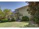 Back exterior featuring a home with a deck and lush greenery at 14103 Grand Traverse Dr, Charlotte, NC 28278