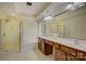 Bathroom featuring a shower, tub, and double vanity with wood cabinets at 14103 Grand Traverse Dr, Charlotte, NC 28278