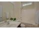Bathroom featuring neutral tones, a single sink vanity, and a combined tub and shower at 14103 Grand Traverse Dr, Charlotte, NC 28278