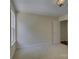 Bright bedroom featuring neutral walls, carpet, a window, and a white door at 14103 Grand Traverse Dr, Charlotte, NC 28278