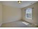 Bedroom featuring neutral carpet, natural lighting and a modern window at 14103 Grand Traverse Dr, Charlotte, NC 28278