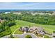Aerial view of the stunning clubhouse, golf course, and surrounding community at 14103 Grand Traverse Dr, Charlotte, NC 28278