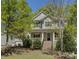Charming two-story home featuring a welcoming front porch and landscaped front yard at 14103 Grand Traverse Dr, Charlotte, NC 28278