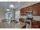 A well-lit kitchen with stainless steel appliances, granite countertops, and a double sink at 14103 Grand Traverse Dr, Charlotte, NC 28278