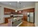 Modern kitchen featuring stainless steel appliances, granite countertops, and ample cabinet space at 14103 Grand Traverse Dr, Charlotte, NC 28278