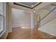 Spacious living room area with hardwood floors, decorative trim, and abundant natural light at 14103 Grand Traverse Dr, Charlotte, NC 28278