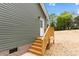 Back entrance featuring steps and wood railing at 1451 Cherryville Rd, Shelby, NC 28150
