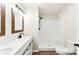 Bathroom featuring single sink vanity with wood framed mirror and a walk in shower at 1451 Cherryville Rd, Shelby, NC 28150