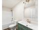 Bathroom featuring a tub-shower combo, a vanity with a unique color, and a large mirror at 1451 Cherryville Rd, Shelby, NC 28150