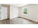Bright bedroom featuring a closet, a window with natural light, and wood-look flooring at 1451 Cherryville Rd, Shelby, NC 28150