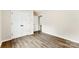 Bedroom showcasing floors, closet doors with black hardware and an adjacent room at 1451 Cherryville Rd, Shelby, NC 28150