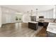 Bright kitchen with center island flowing into the living space with ample natural light from large windows at 1451 Cherryville Rd, Shelby, NC 28150