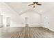 Bright living room featuring high ceilings, wood-look floors, and ample natural light from the windows at 1451 Cherryville Rd, Shelby, NC 28150