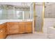 Bathroom features a glass-enclosed shower, soaking tub, vanity with ample counter space at 19113 Southport Dr, Cornelius, NC 28031