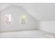 Spacious bedroom with neutral carpet and walls, highlighted by bright windows and a vaulted ceiling at 19113 Southport Dr, Cornelius, NC 28031