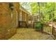 Wooden deck and brick siding, with view of lush greenery creating a private outdoor space at 19113 Southport Dr, Cornelius, NC 28031