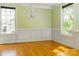 Bright living room featuring classic wainscoting, and hardwood floors at 19113 Southport Dr, Cornelius, NC 28031