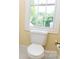 Small bathroom featuring a toilet and window at 19113 Southport Dr, Cornelius, NC 28031
