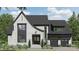Charming two-story home featuring a stylish white brick facade, a modern black roof, and a well-manicured front yard at 19134 Newburg Hill Rd, Davidson, NC 28036