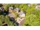 Overhead view of multiple homes in a verdant, established neighborhood with mature trees at 206 Coburn Ct, Fort Mill, SC 29715