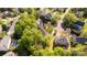 Aerial shot of homes nestled among lush trees in a peaceful, residential community at 206 Coburn Ct, Fort Mill, SC 29715