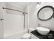 Cozy bathroom featuring a tub/shower combo, toilet, and a white sink with a black countertop at 206 Coburn Ct, Fort Mill, SC 29715
