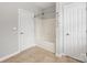 Bright bathroom with a white tub and shower combination, tiled floor, and neutral paint at 206 Coburn Ct, Fort Mill, SC 29715