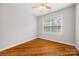 Bedroom featuring hardwood floors, neutral walls, a ceiling fan, and a window with natural light at 206 Coburn Ct, Fort Mill, SC 29715