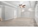 Spacious bedroom boasts a ceiling fan, trey ceilings, natural lighting and neutral carpeting at 206 Coburn Ct, Fort Mill, SC 29715