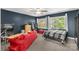 Cozy bedroom with warm-toned walls, comfortable seating, and natural light from two windows at 206 Coburn Ct, Fort Mill, SC 29715
