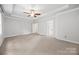 Huge bedroom with a ceiling fan, trey ceilings, natural lighting and neutral carpeting at 206 Coburn Ct, Fort Mill, SC 29715